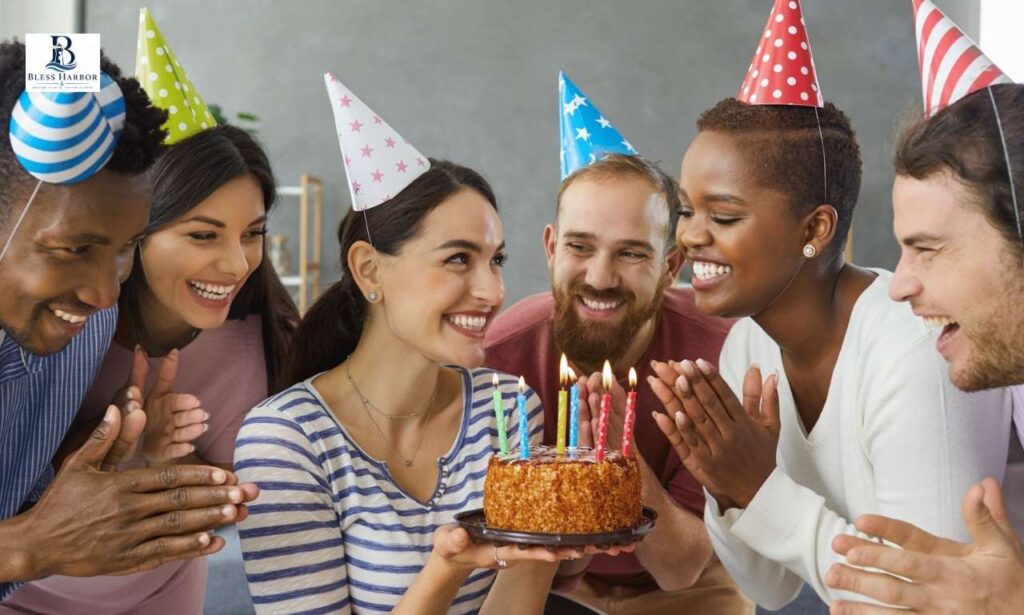 Friends celebrating a birthday with cake and party hats