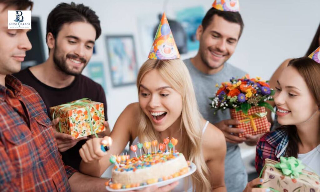 Friends celebrating a birthday with cake, gifts and flowers